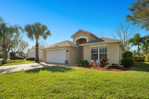 House front with House number plaque to right of garage