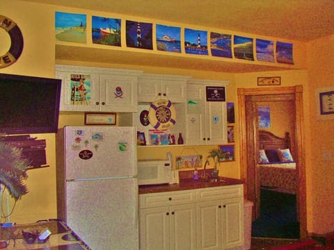 Kitchenette and 2 bedrooms on walk in level off pool, grill, and volleyball.