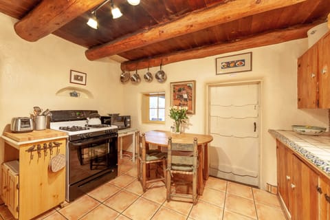Mexican tile in the kitchen and a cozy spot to have breakfast. 
