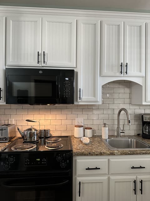 Newly installed GE microwave and oven.