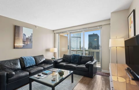 Living room with queen sleeper sofa and balcony access
