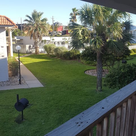 View of pool and ground from balcony