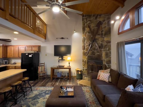 Open-concept family room and kitchen on third floor