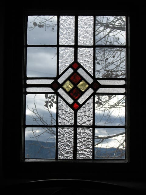 Stained glass widow in each bedroom and bathroom!