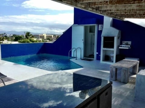 Top roof pool, with chill out area and BBQ overseeing the ocean