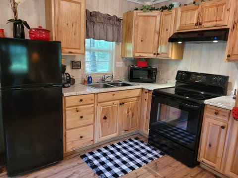 Full kitchen with microwave; hand and dish washing soap provided.