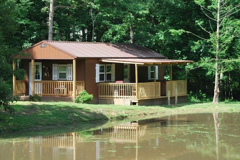 Hummingbird Cabin front and back porches, close up view from across the pond.