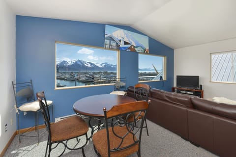 Spacious living room and dining area with views of the harbor and bay!