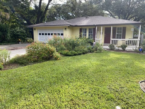 Front of the house with the butterfly gardens.