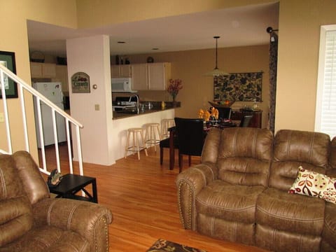 View for the living room looking into dining room and kitchen area.