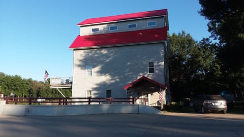 Mill's new roof from North Cherry Street. Enter street unit under red porch roof