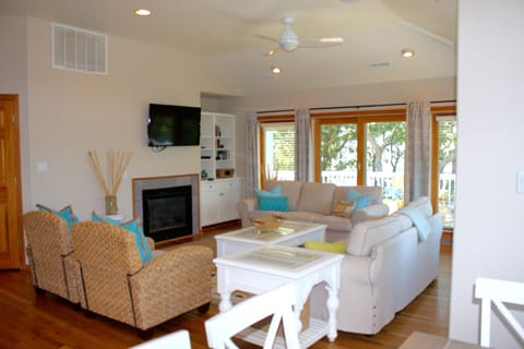 Bright, clean living room;  smart TV, sliders to deck...