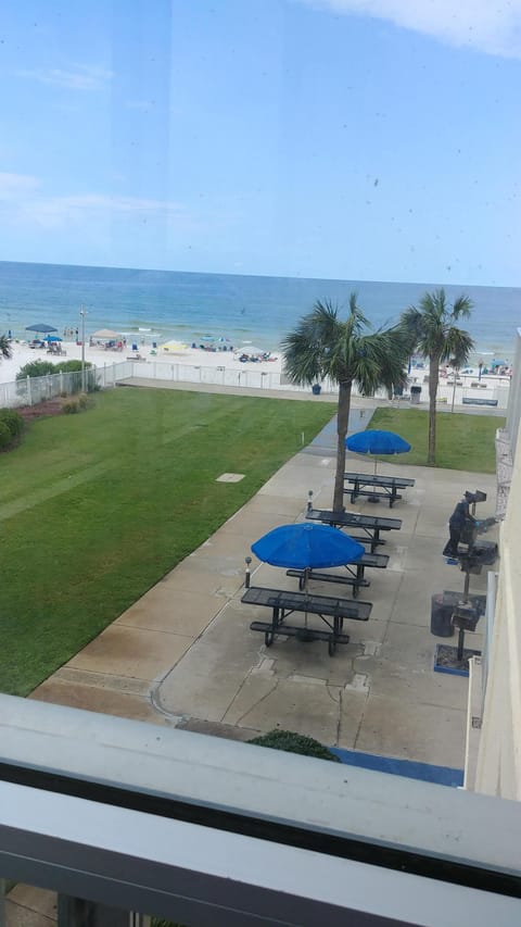 Grill and picnic area with new tables and umbrellas as viewed from my balcony.