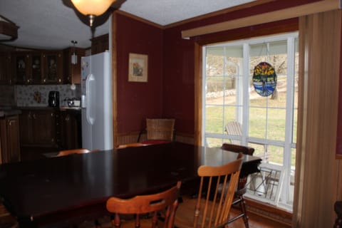 Dining with front porch/yard views. Watch the birds