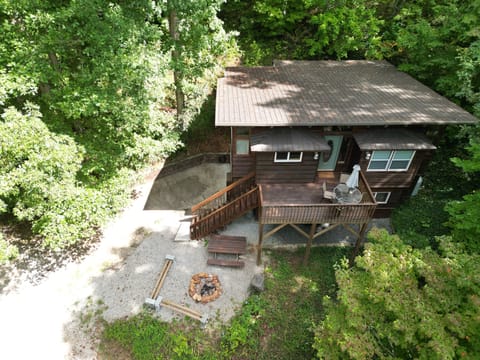cabin with fire pit and balcony