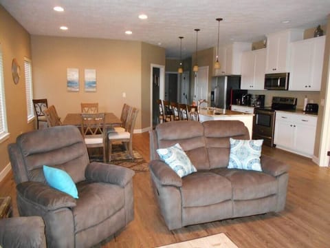 Large open living room with comfortable furniture for after a long day playing outside.