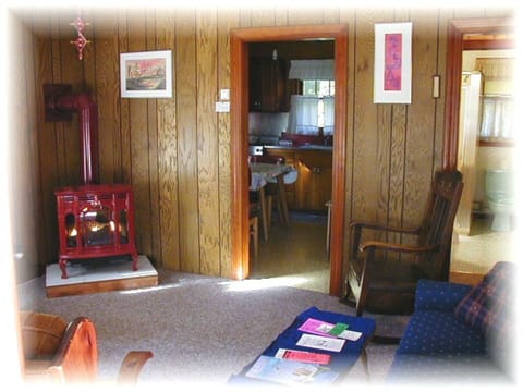 Cozy main room with a Ben Franklin style gas heat stove in case of a chilly nite