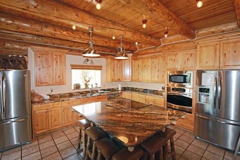 Fully stocked kitchen with all the cooking supplies and appliances needed.