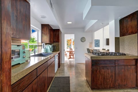 Pop-out window from the kitchen sink also original to 1969.