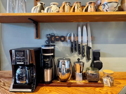 Coffee Station: Insulated French press, Mr. Coffee drip coffee maker with gold filter, moka pot, milk frother, Bodum pour over, coffee grinder, fresh medium roast Fair Trade coffee beans, assortment of teas and an on-demand hot water dispenser .