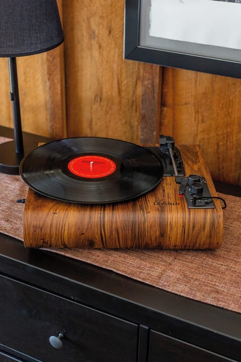 Turntable with a collection of records.