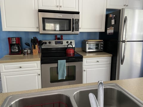 Complete Stainless steel kitchen (dishwasher, range, microwave and refrigerator)