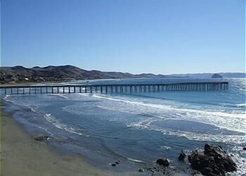 View of Cayucos Pier from condo deck.  Morro Rock can be seen in the background.