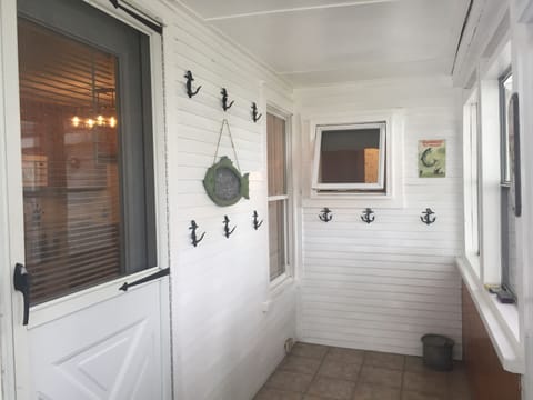 entry in screened in porch to hang your gear and towels