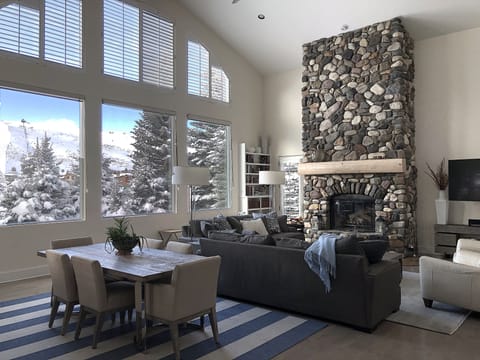 2-story picture windows of mountains in great room.