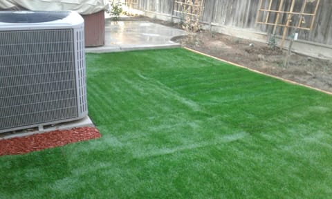 Jacuzzi & grass in backyard. Not shown: 4 patio tables & BBQ grill with storage