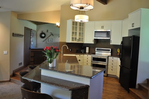 Spacious kitchen, counter seating; induction stove; dual oven