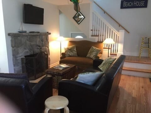 Living Room with Fireplace, Couch, Loveseat, and Chair (view from Front Door)