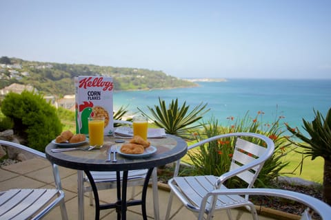 Breakfast on the sea terrace with views towards St Ives Harbour 