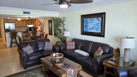 Comfortable,  leather couch, loveseat and chair with open concept floor plan