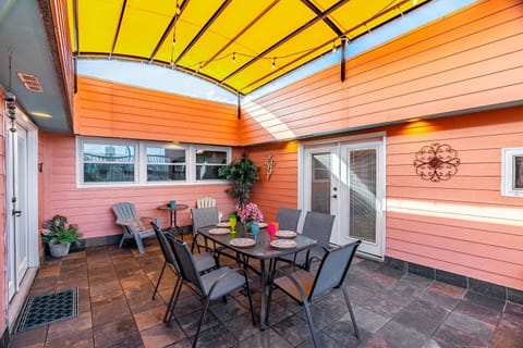 Covered patio, seating for 8, string lights, cozy vibes