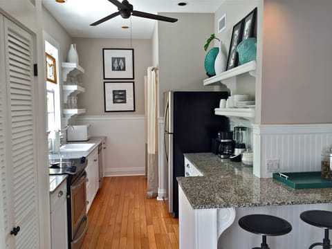 Cozy breakfast bar at one end and over-sized washer and dryer at the other end.