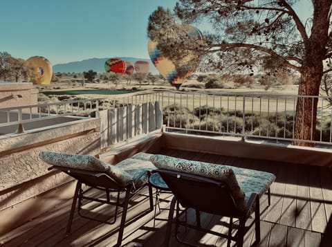 View from private veranda. Balloons glide over property and land on golf course