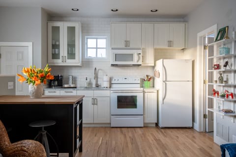 Well equipped kitchen with Carrera countertops.