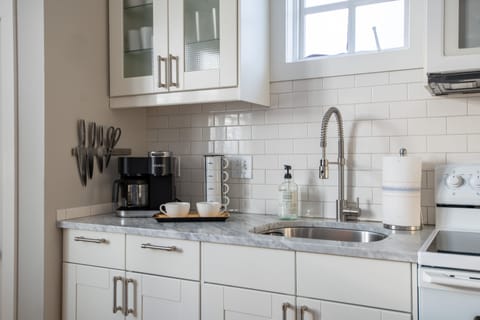 Well equipped kitchen with Carrera countertops. Standard and k-cup coffeemaker