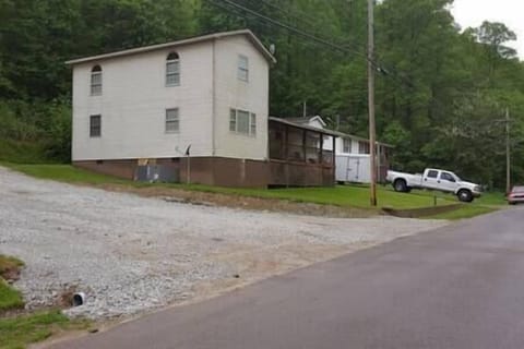Side view of house and part of the second driveway 