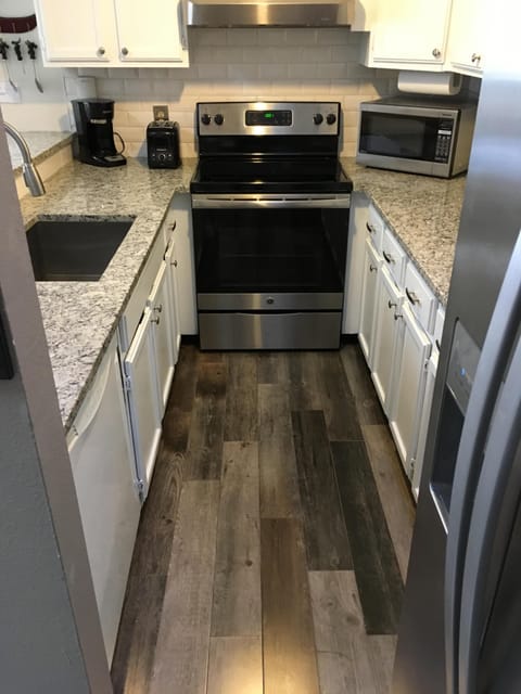 Beautifully updated kitchen w/ granite counter tops, stainless steal appliances.