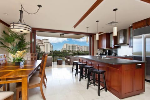 Open concept kitchen and dining area looking out into the lanai