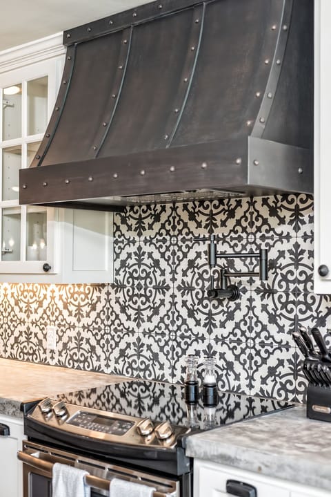 Custom hood with Potfiller & imported tile & concrete countertops