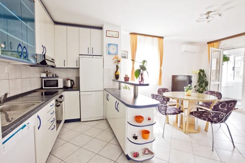 Fully equipped kitchen, large fridge, oven, stove, microwave, kettle, dishwasher