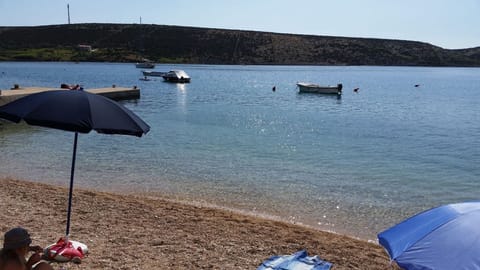 Sand Beach in front of house only 20 meter far and sea berths for guests boats 
