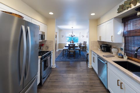 Open plan kitchen wrapping around to dining & family room, patio deck adjacent! 