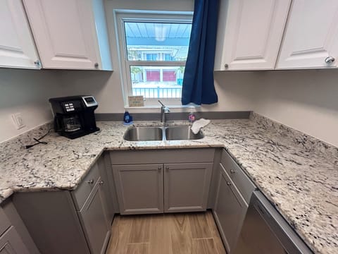 Kitchen with granite countertops, new induction range, and new refrigerator