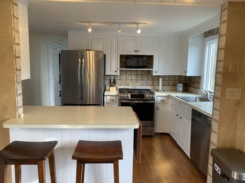 Kitchen island next to sunroom