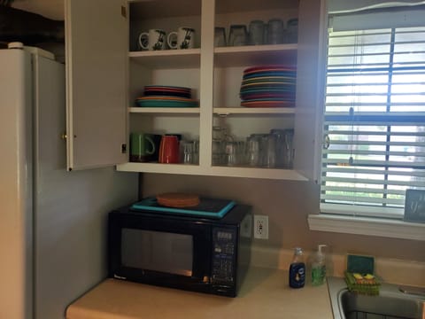 Fully stocked kitchen with microwave