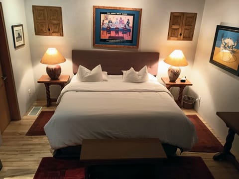 King size bed, side tables with USB charger, analog clock.